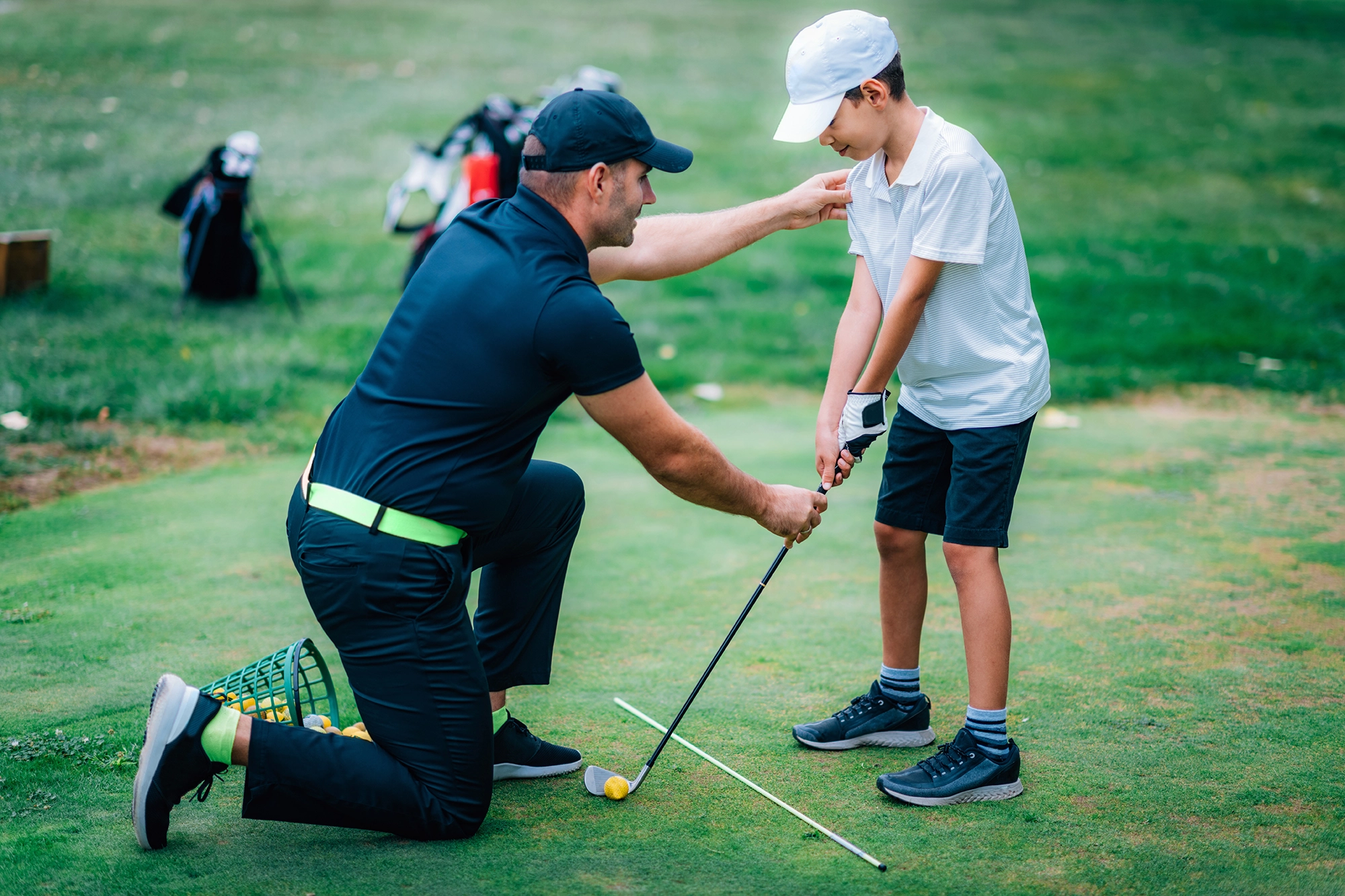 Coach Patrick with a junior golfer